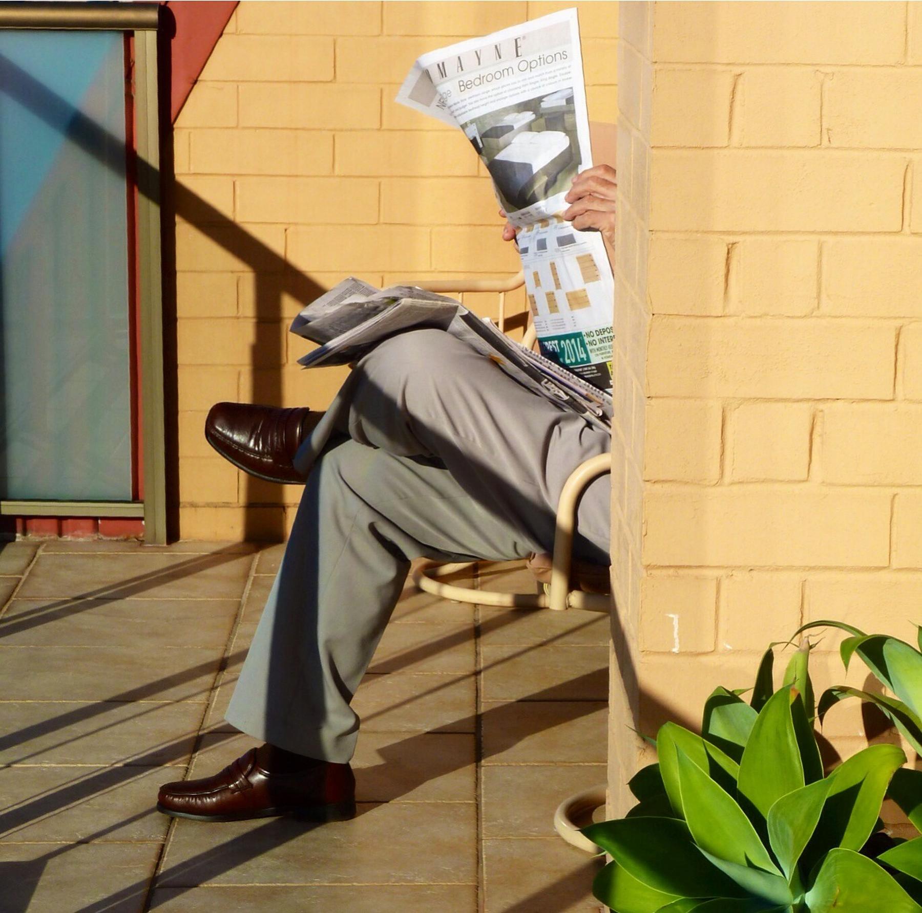 File:Far From The Madding Crowd...(Catching up with the news) - panoramio.jpg - a man sitting on a c